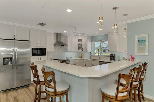 Interior, Kitchen, Pendant Lights, Recessed Lighting, Stainless Steel Appliances, Wood Texture Flooring