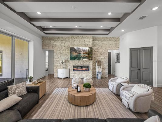 Fireplace, Interior, Living room, Recessed Lighting, Stone Walls, Wood Texture Flooring