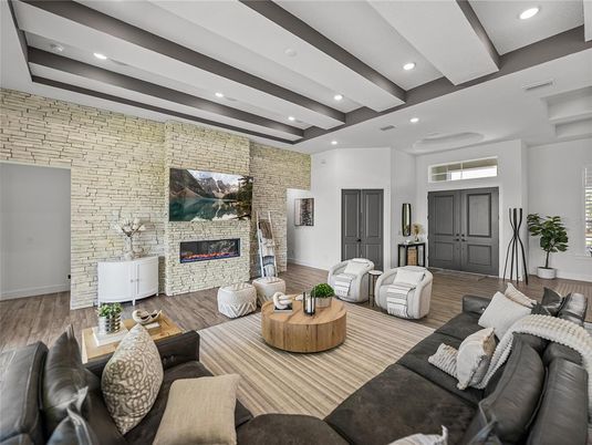 Fireplace, Interior, Living room, Recessed Lighting, Stone Walls, Wood Texture Flooring