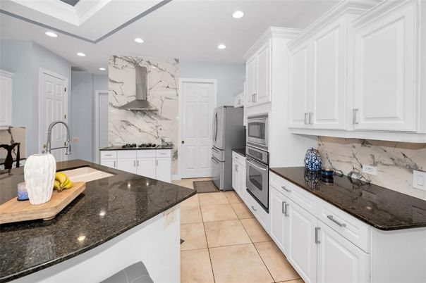 Interior, Kitchen, Marble Walls, Recessed Lighting, Stainless Steel Appliances