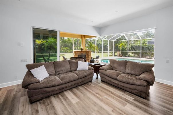 Fireplace, Interior, Living room, Recessed Lighting, Sun Room, Wood Texture Flooring