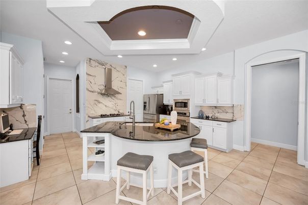 Interior, Kitchen, Marble Walls, Recessed Lighting, Stainless Steel Appliances