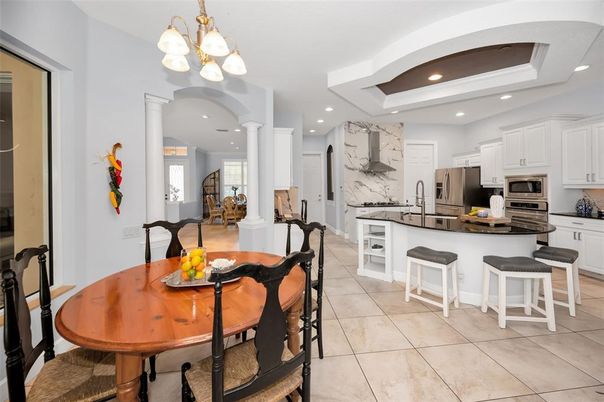 Chandelier, Dining room, Interior, Kitchen, Marble Walls, Recessed Lighting, Stainless Steel Appliances