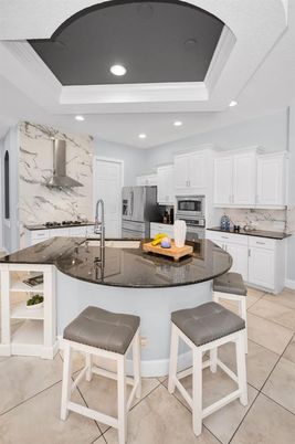 Interior, Kitchen, Marble Walls, Recessed Lighting, Stainless Steel Appliances