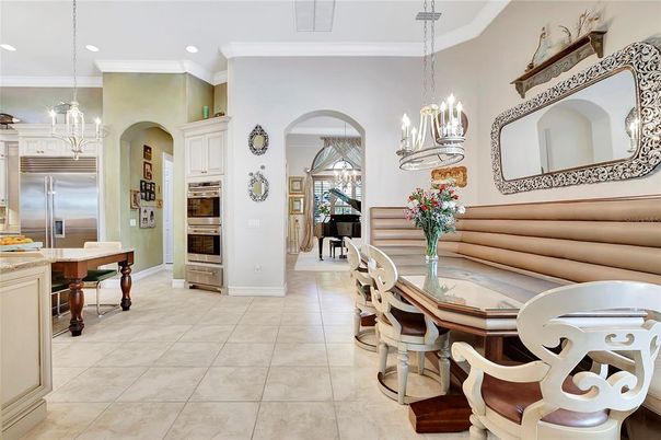 Chandelier, Dining room, Interior, Kitchen, Pendant Lights, Piano, Recessed Lighting, Stainless Steel Appliances