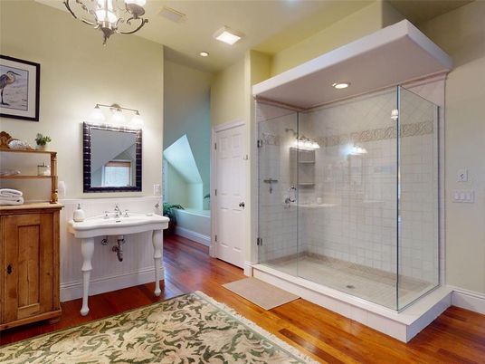 Bathroom, Chandelier, Glass Shower, Interior, Recessed Lighting, Wood Texture Flooring