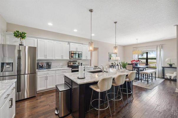 Dining room, Interior, Kitchen, Pendant Lights, Recessed Lighting, Stainless Steel Appliances, Wood Texture Flooring