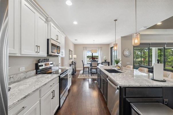 Dining room, Interior, Kitchen, Living room, Pendant Lights, Recessed Lighting, Stainless Steel Appliances, Wood Texture Flooring