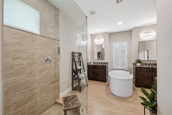 Bathroom, Dual Sink Vanities, Free Standing Baths, Glass Shower, Interior, Recessed Lighting, Wood Texture Flooring