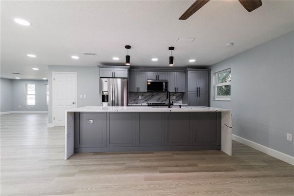Interior, Kitchen, Pendant Lights, Recessed Lighting, Stainless Steel Appliances, Wood Texture Flooring