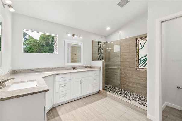 Bathroom, Dual Sink Vanities, Glass Shower, Interior, Recessed Lighting, Wood Texture Flooring