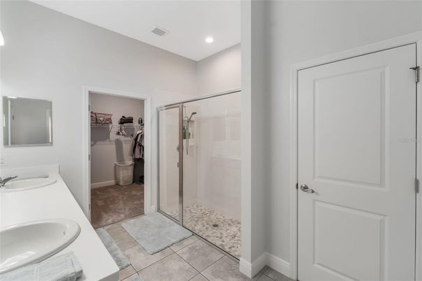 Bathroom, Dual Sink Vanities, Glass Shower, Interior, Recessed Lighting, Walk-in Closets