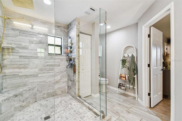 Bathroom, Glass Shower, Interior, Marble Walls, Recessed Lighting, Wood Texture Flooring