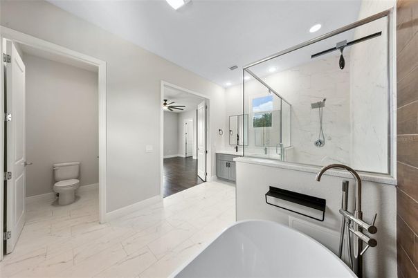 Bathroom, Dual Sink Vanities, Free Standing Baths, Glass Shower, Interior, Marble, Marble Walls, Recessed Lighting