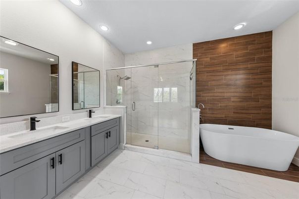 Bathroom, Dual Sink Vanities, Free Standing Baths, Glass Shower, Interior, Marble, Marble Walls, Recessed Lighting