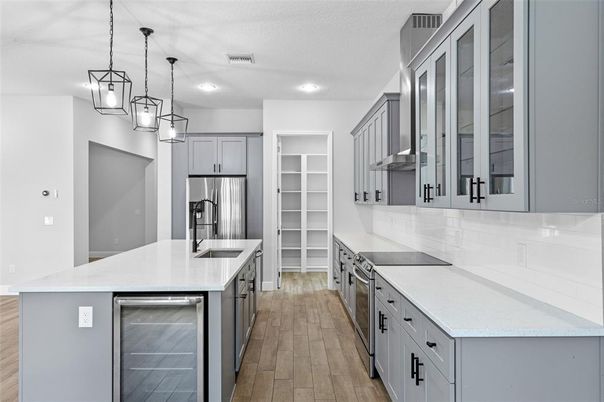 Interior, Kitchen, Pendant Lights, Recessed Lighting, Stainless Steel Appliances, Wood Texture Flooring
