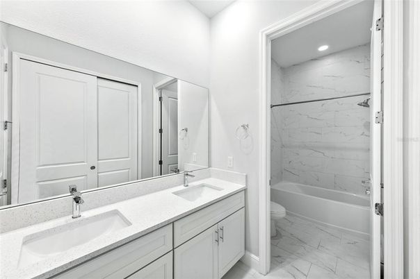Bathroom, Dual Sink Vanities, Interior, Marble, Marble Walls, Recessed Lighting