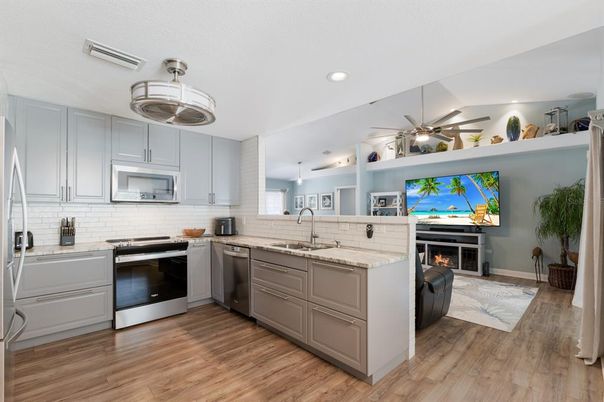 Fireplace, Interior, Kitchen, Pendant Lights, Recessed Lighting, Stainless Steel Appliances, Wood Texture Flooring