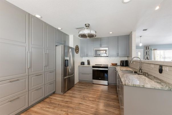 Interior, Kitchen, Pendant Lights, Recessed Lighting, Stainless Steel Appliances, Wood Texture Flooring
