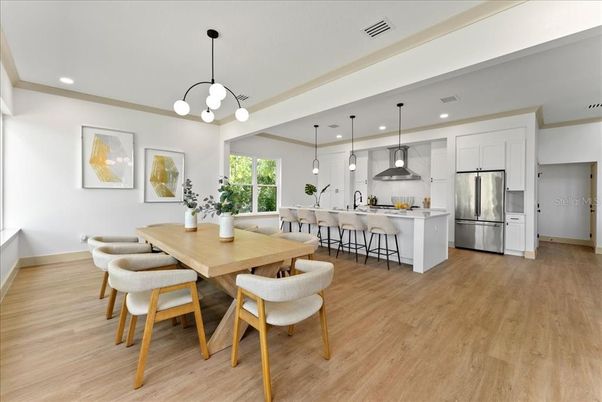 Dining room, Interior, Kitchen, Pendant Lights, Recessed Lighting, Stainless Steel Appliances, Wood Texture Flooring