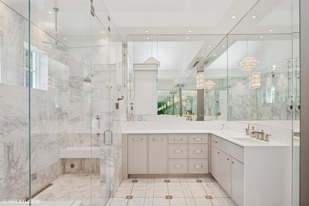 Bathroom, Chandelier, Dual Sink Vanities, Glass Shower, Interior, Marble, Marble Walls, Pendant Lights, Recessed Lighting