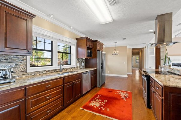 Chandelier, Interior, Kitchen, Recessed Lighting, Stainless Steel Appliances, Wood Texture Flooring