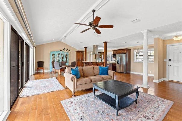 Chandelier, Dining room, Interior, Kitchen, Living room, Pendant Lights, Recessed Lighting, Stainless Steel Appliances, Wood Texture Flooring