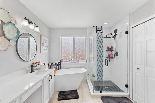 Bathroom, Dual Sink Vanities, Free Standing Baths, Glass Shower, Interior, Recessed Lighting, Wood Texture Flooring