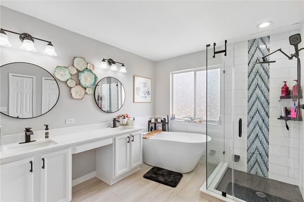 Bathroom, Dual Sink Vanities, Free Standing Baths, Glass Shower, Interior, Recessed Lighting, Wood Texture Flooring