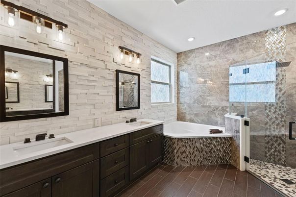Bathroom, Dual Sink Vanities, Glass Shower, Interior, Recessed Lighting, Stone Walls, Wood Texture Flooring