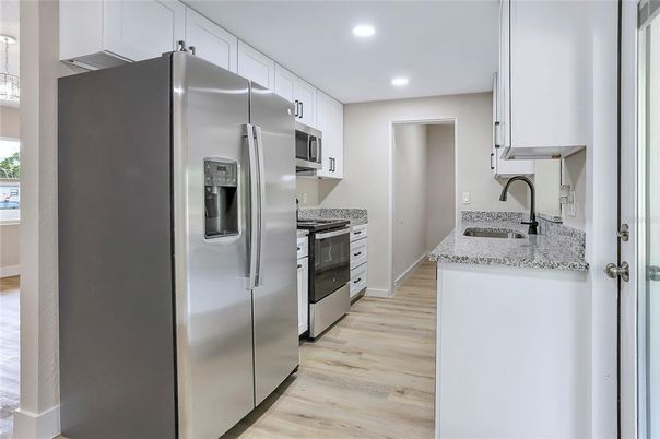 Interior, Kitchen, Recessed Lighting, Stainless Steel Appliances, Wood Texture Flooring
