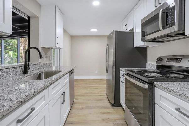 Interior, Kitchen, Recessed Lighting, Stainless Steel Appliances, Wood Texture Flooring