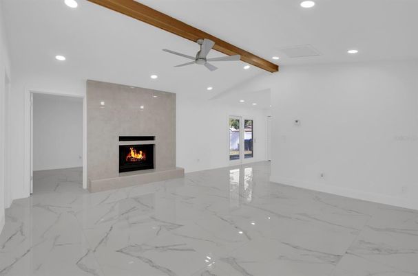 Empty room, Fireplace, Interior, Marble, Recessed Lighting, Wooden Beams