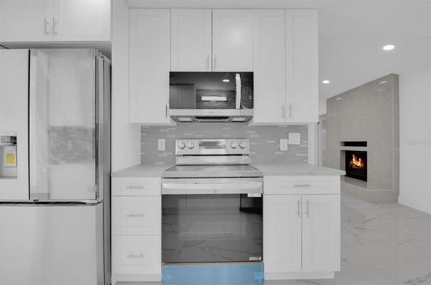 Fireplace, Interior, Kitchen, Marble, Recessed Lighting, Stainless Steel Appliances