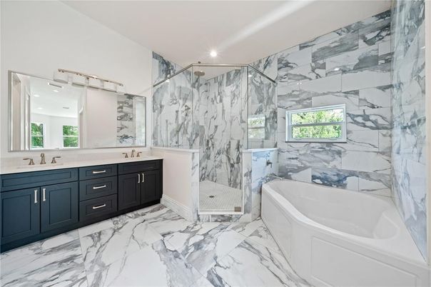 Bathroom, Dual Sink Vanities, Free Standing Baths, Glass Shower, Interior, Marble, Marble Walls, Recessed Lighting
