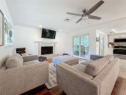 Fireplace, Interior, Kitchen, Living room, Recessed Lighting, Stainless Steel Appliances, Wood Texture Flooring