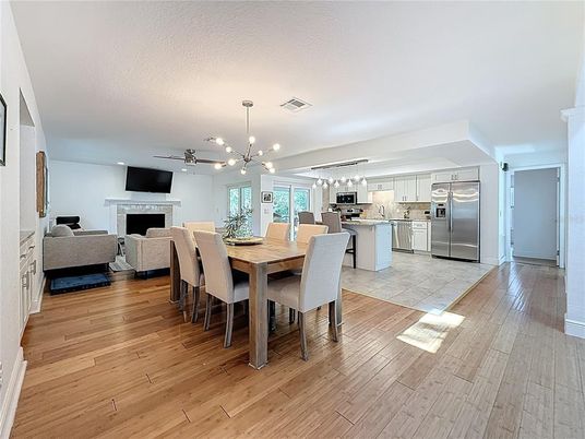 Dining room, Fireplace, Interior, Kitchen, Living room, Pendant Lights, Stainless Steel Appliances, Wood Texture Flooring