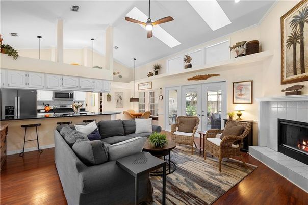 Fireplace, Interior, Kitchen, Living room, Pendant Lights, Stainless Steel Appliances, Wood Texture Flooring