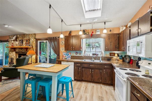 Fireplace, Interior, Kitchen, Pendant Lights, Stone Walls, Wood Texture Flooring