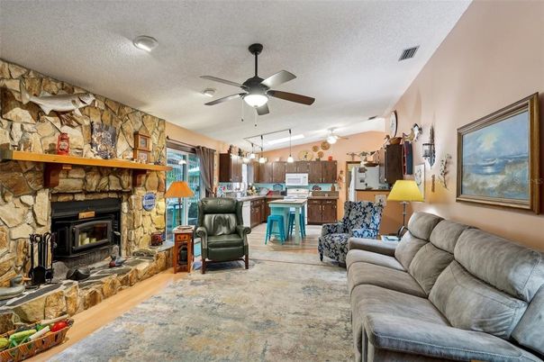 Fireplace, Interior, Kitchen, Living room, Pendant Lights, Stone Walls, Wood Texture Flooring
