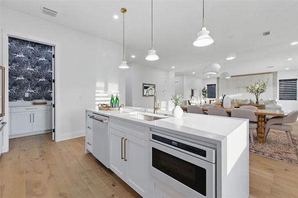 Dining room, Interior, Kitchen, Pendant Lights, Recessed Lighting, Stainless Steel Appliances, Wood Texture Flooring