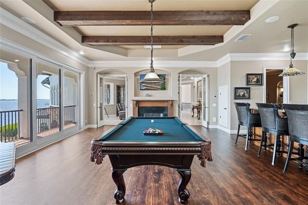 Billiard Table, Fireplace, Game Room, Interior, Pendant Lights, Recessed Lighting, Water, Wooden Beams, Wood Texture Flooring