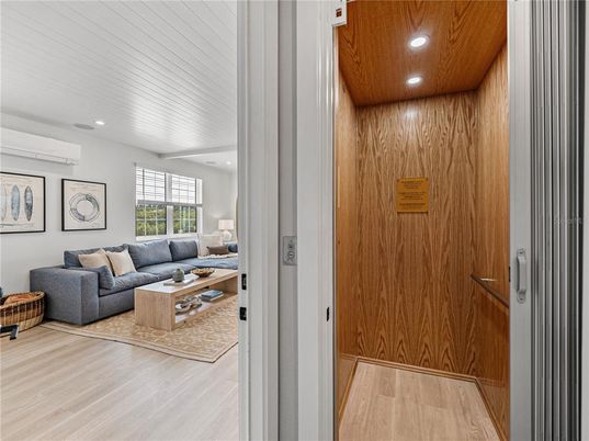 Elevator, Interior, Living room, Recessed Lighting, Wooden Ceilings, Wood Texture Flooring, Wooden Walls