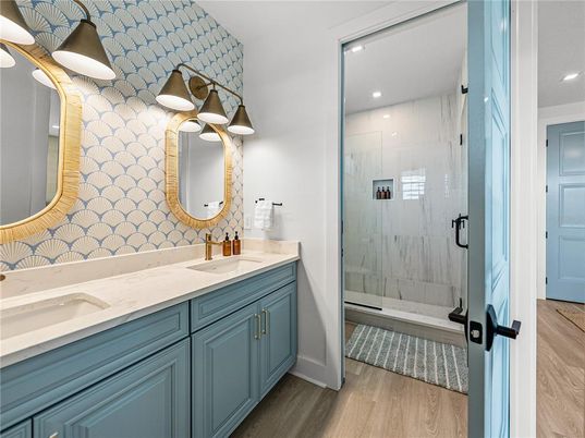 Bathroom, Dual Sink Vanities, Glass Shower, Interior, Recessed Lighting, Wood Texture Flooring