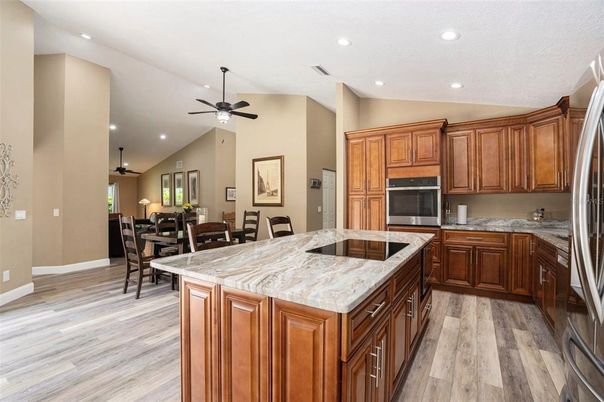 Dining room, Interior, Kitchen, Recessed Lighting, Stainless Steel Appliances, Wood Texture Flooring