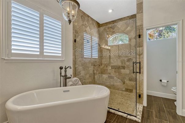 Bathroom, Free Standing Baths, Glass Shower, Interior, Recessed Lighting, Wood Texture Flooring