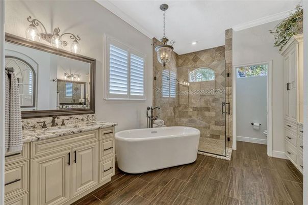 Bathroom, Dual Sink Vanities, Free Standing Baths, Glass Shower, Interior, Pendant Lights, Recessed Lighting, Wood Texture Flooring