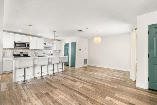 Interior, Kitchen, Pendant Lights, Recessed Lighting, Stainless Steel Appliances, Wood Texture Flooring
