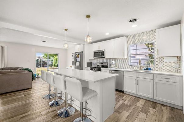 Interior, Kitchen, Pendant Lights, Recessed Lighting, Stainless Steel Appliances, Wood Texture Flooring