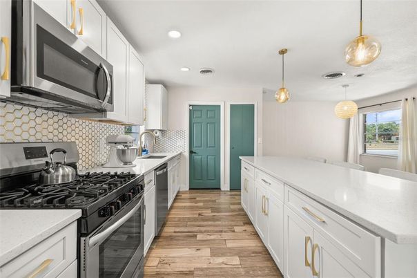 Interior, Kitchen, Pendant Lights, Recessed Lighting, Stainless Steel Appliances, Wood Texture Flooring